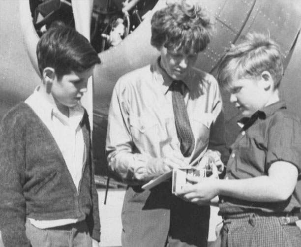 Amelia Earhat Authographing Picture For Two Young Boy