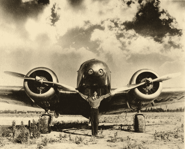 Amelia Posing with Lockheed Wings