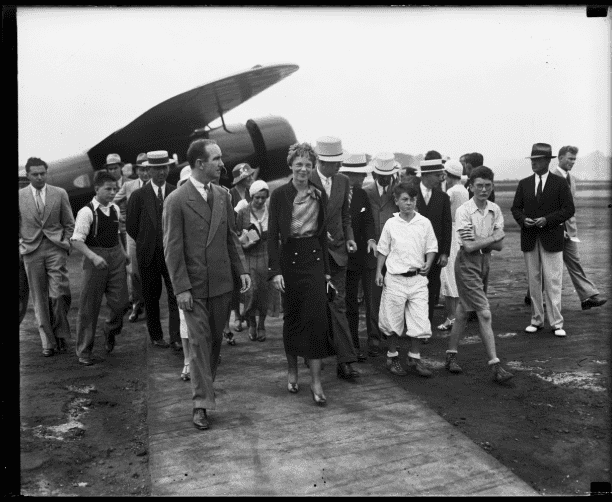 Amelia Earhart Walking with Group