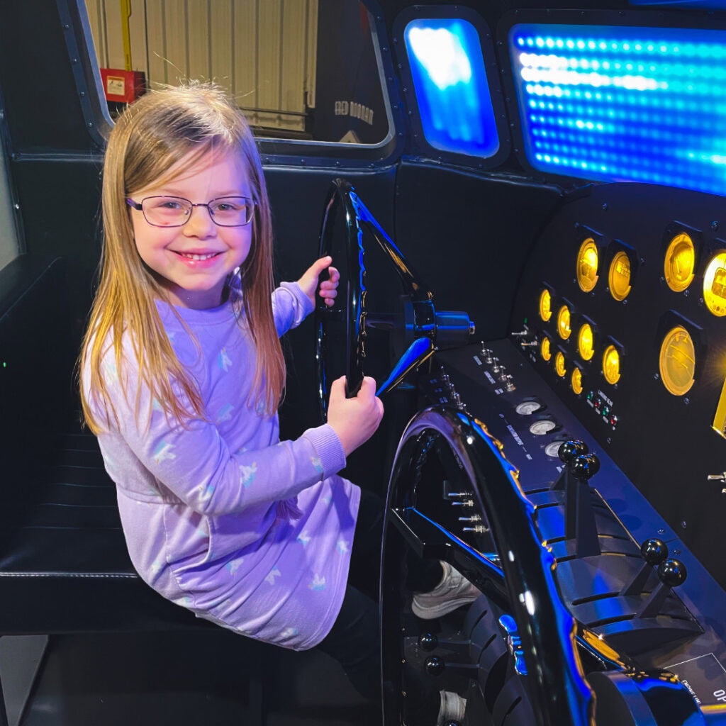 Young girl at controls of plane
